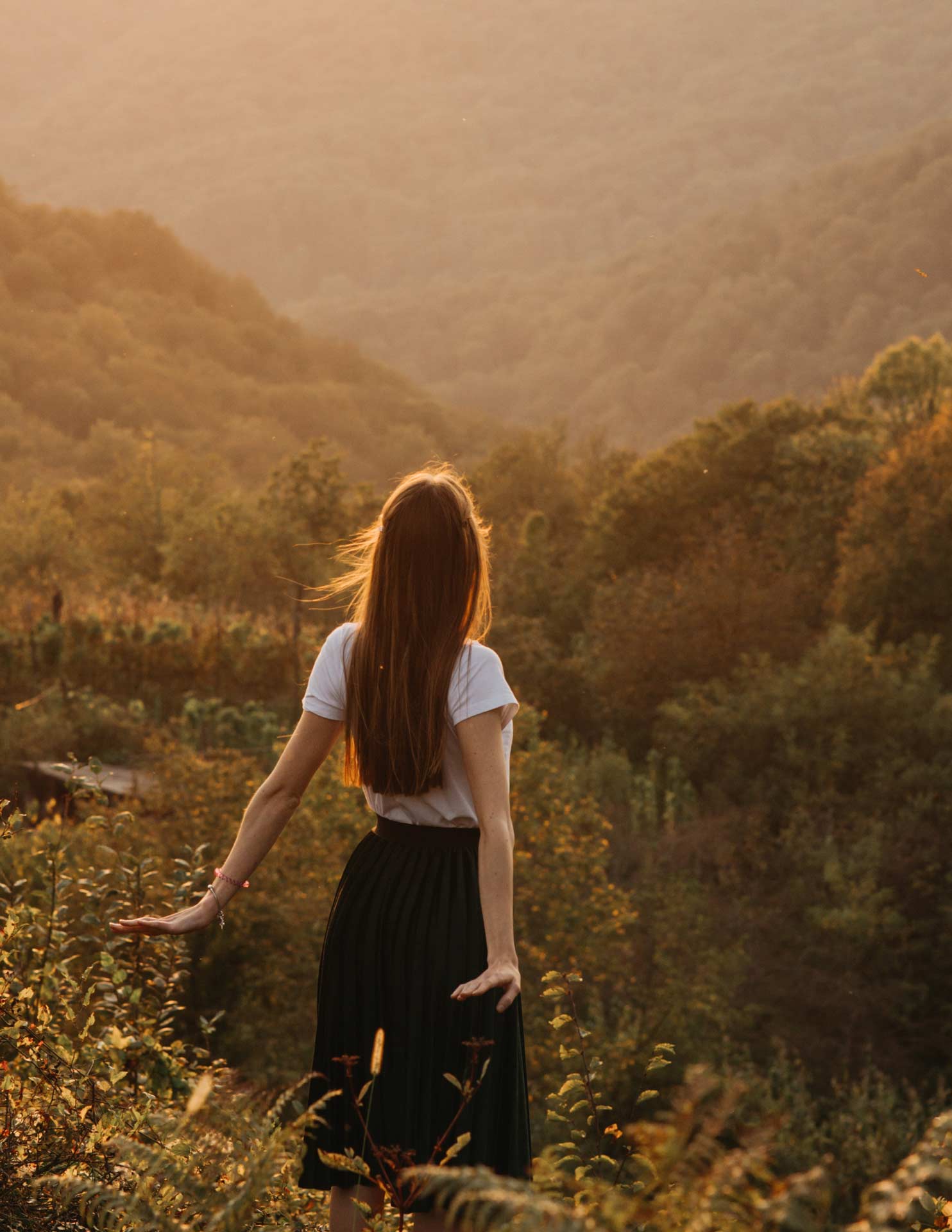 woman in the mountains in the sunlight